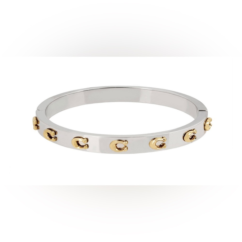 NWOT Silver-tone metal hinged bangle bracelet detailed with gold-tone